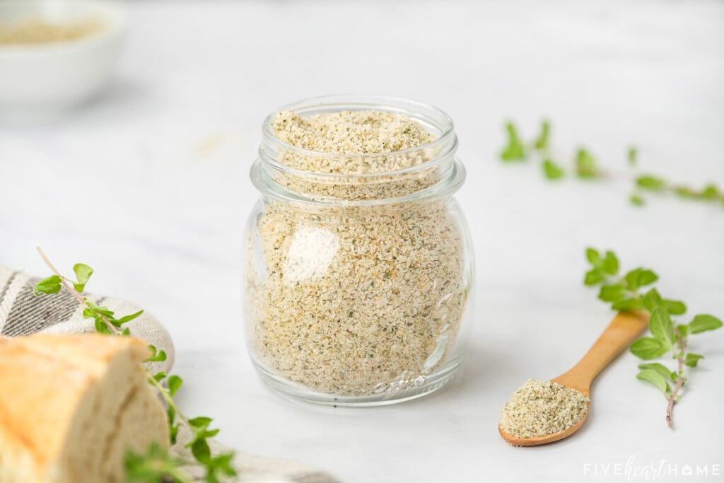 Glass jar and wooden spoon with Italian Bread Crumbs.