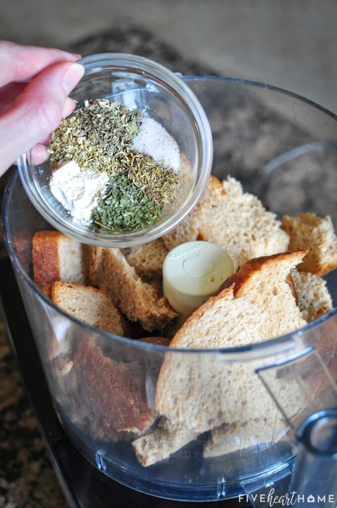 How to Make Italian Bread Crumbs by adding bread and herbs to food processor.