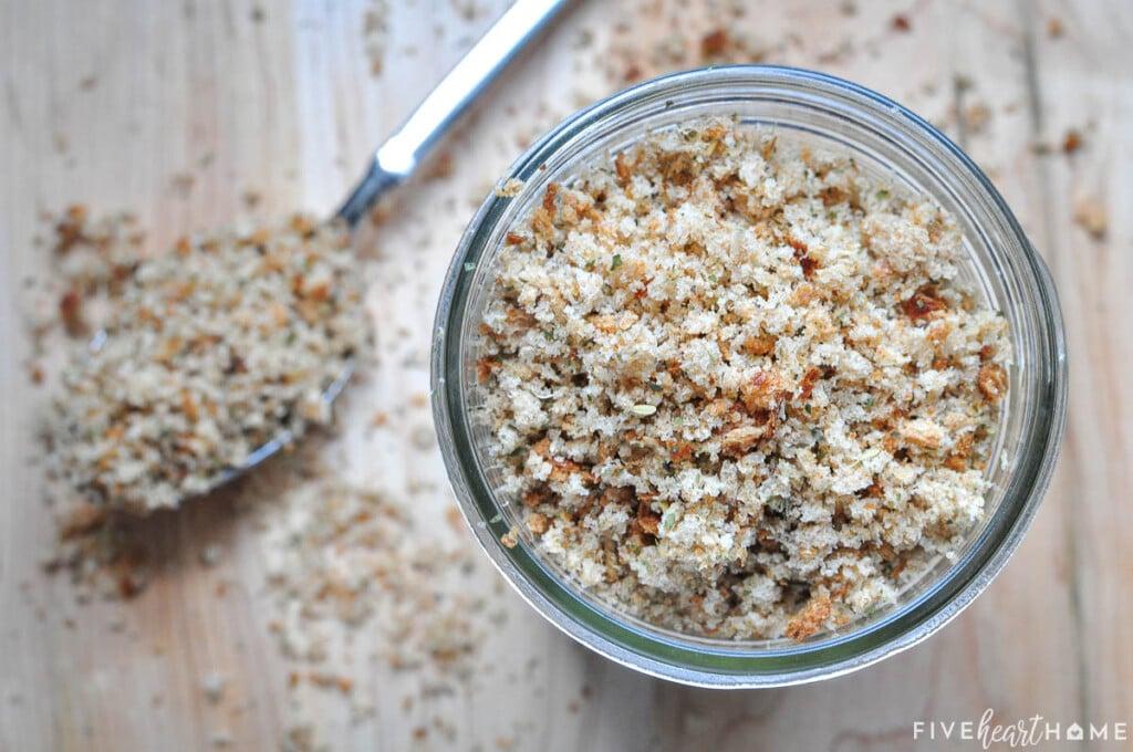 Italian Bread Crumbs in jar with spoon.