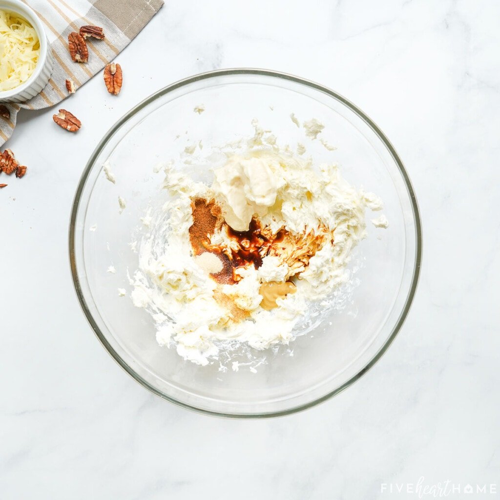 Adding Worcestershire sauce and spices to bowl.