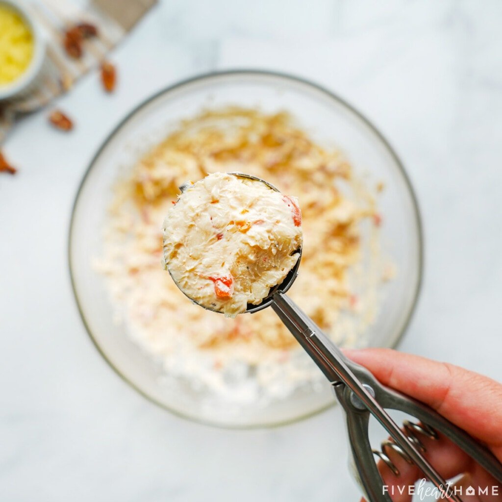 Scooping pimento cheese into balls.