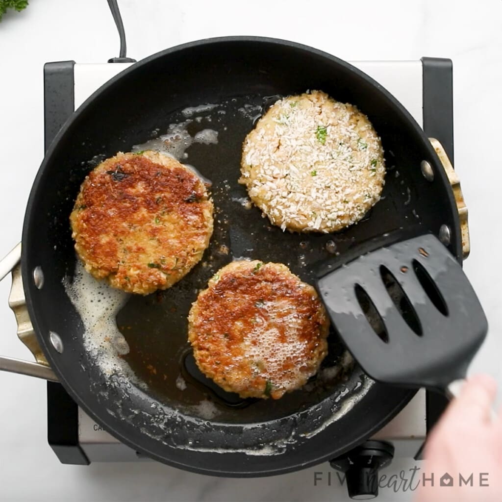 Salmon Patty recipe frying in pan.