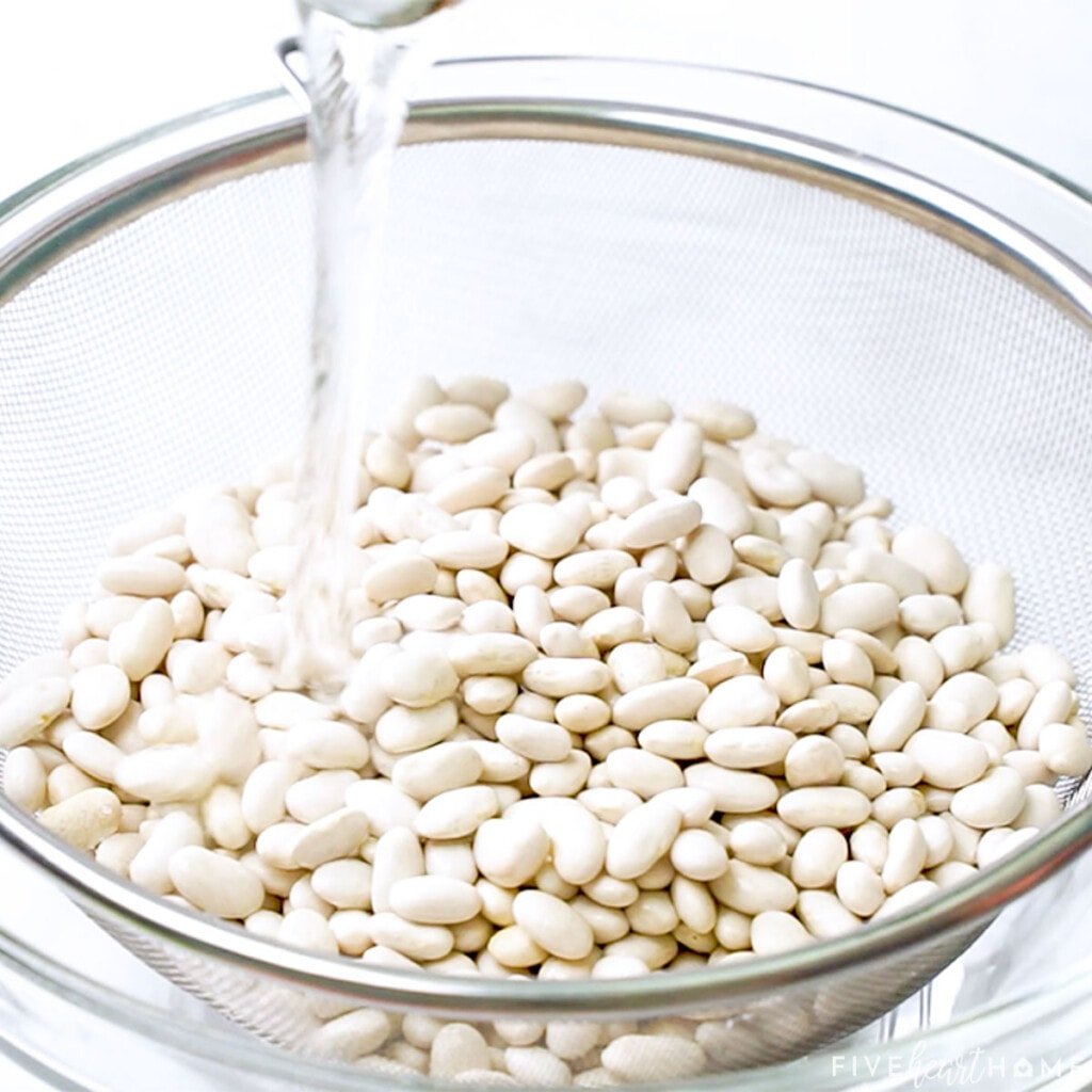 Rinsing beans for Cajun white beans recipe.