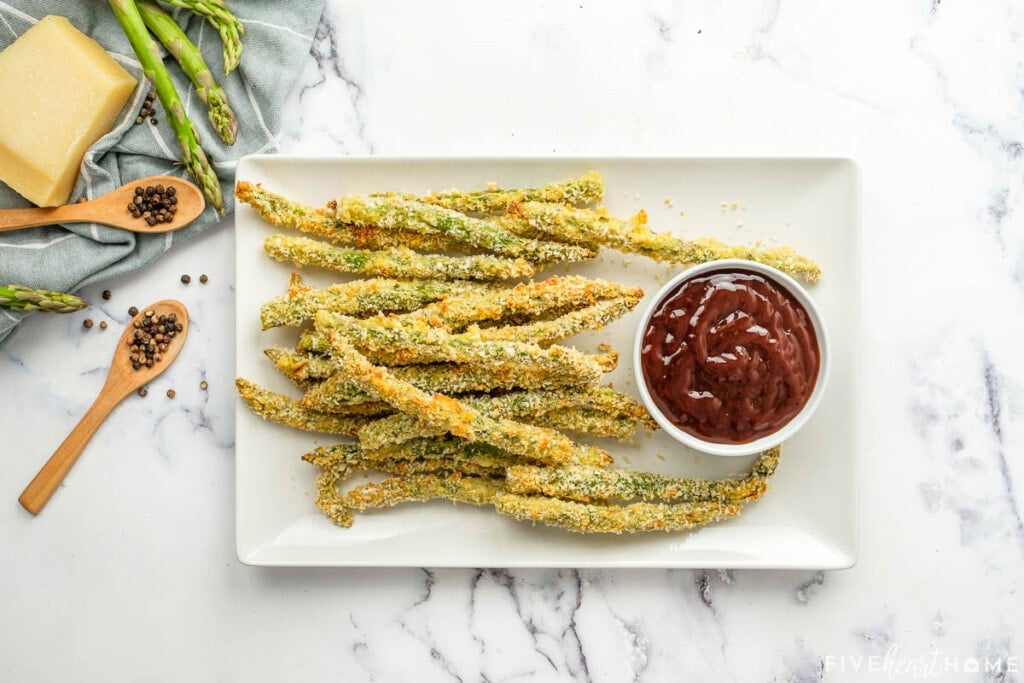 Aerial view of Asparagus Fries with ketchup for dipping.