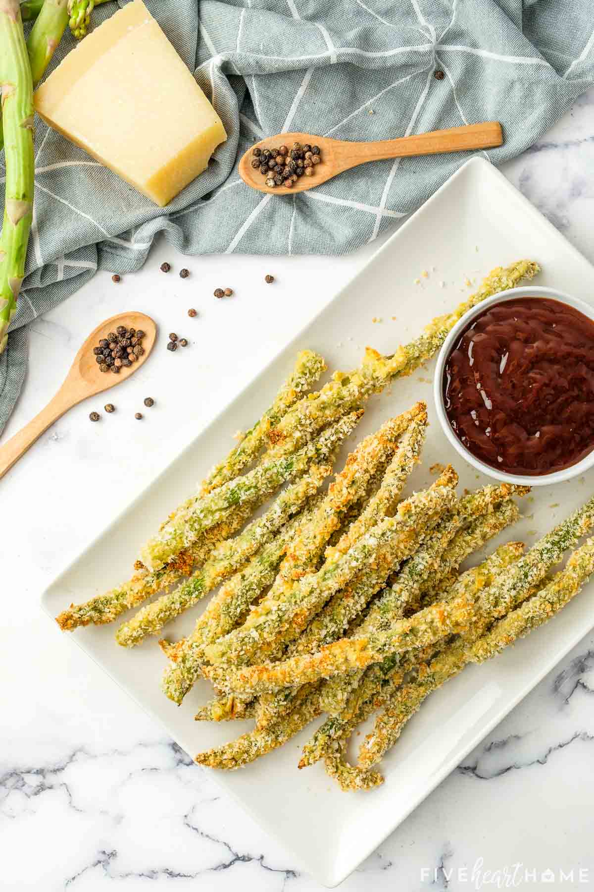 Aerial view of Asparagus Fries on white platter.