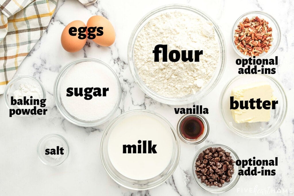 Aerial view of labeled ingredients to make basic muffin recipes.