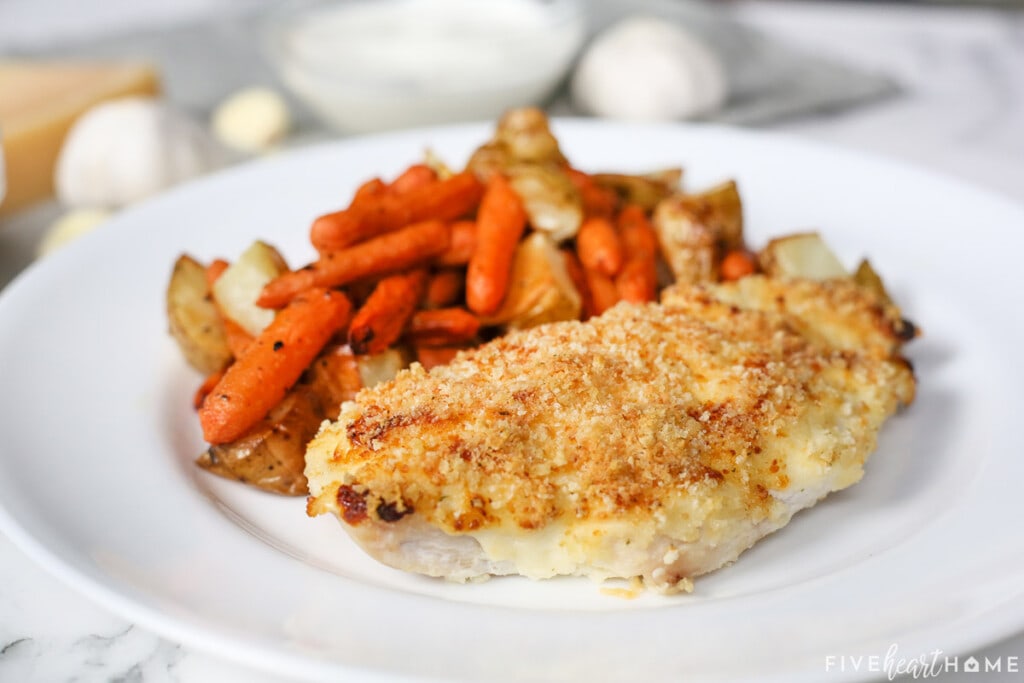 Panko Chicken on plate with roasted carrots and potatoes.