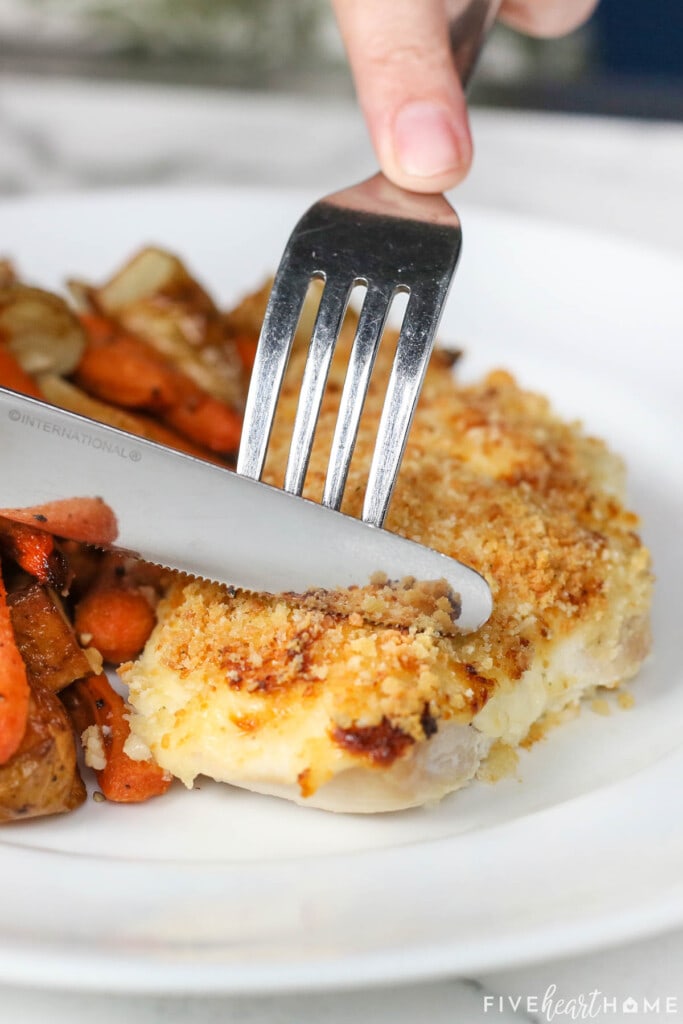 Cutting into Panko Crusted Chicken breast.