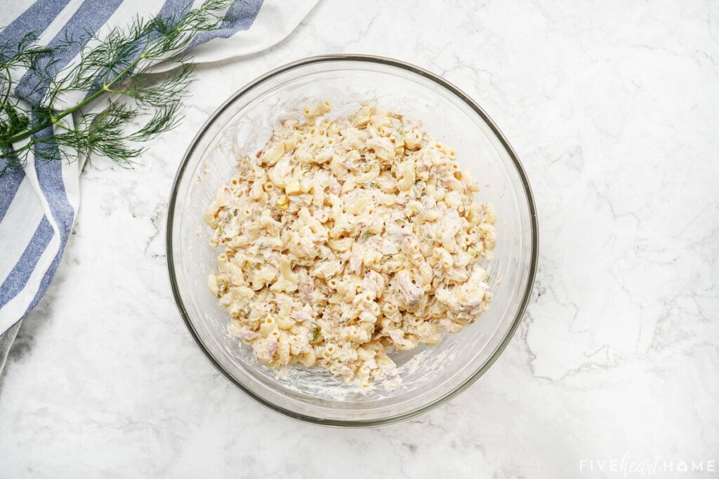 Tuna macaroni salad in glass bowl.