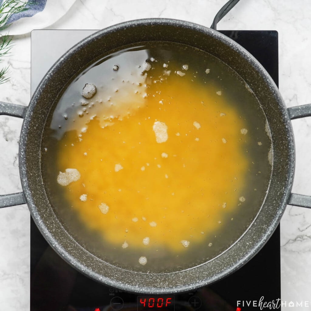 Boiling macaroni in pot.