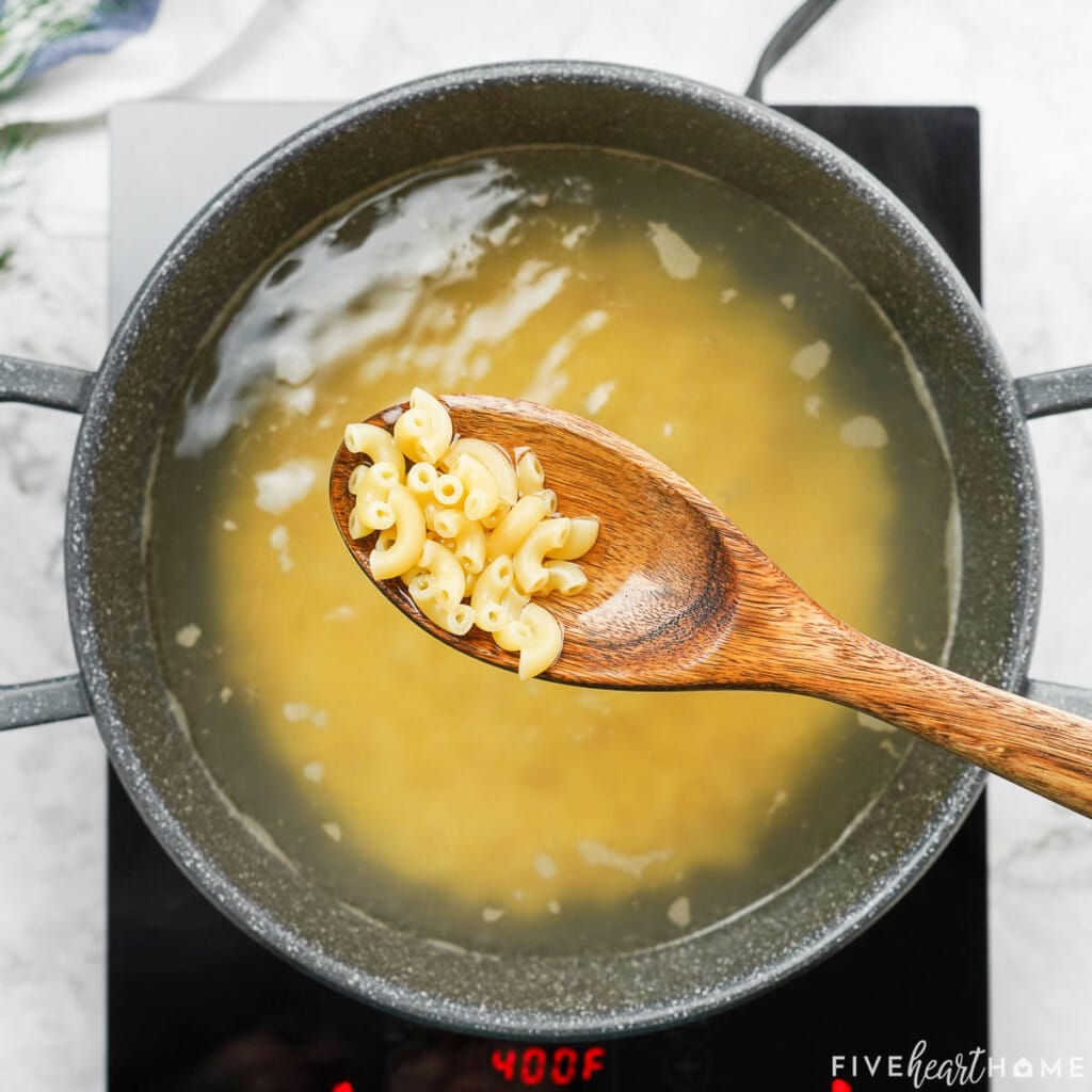 Macaroni on wooden spoon cooked al dente.