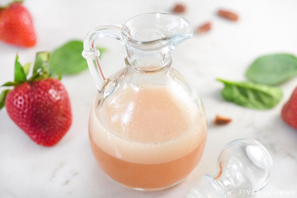 Blush Wine Vinaigrette recipe in glass bottle with lid.