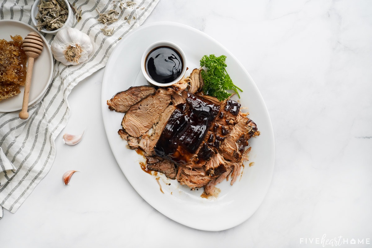 Aerial view of Crock Pot Pork Loin on platter with glaze.