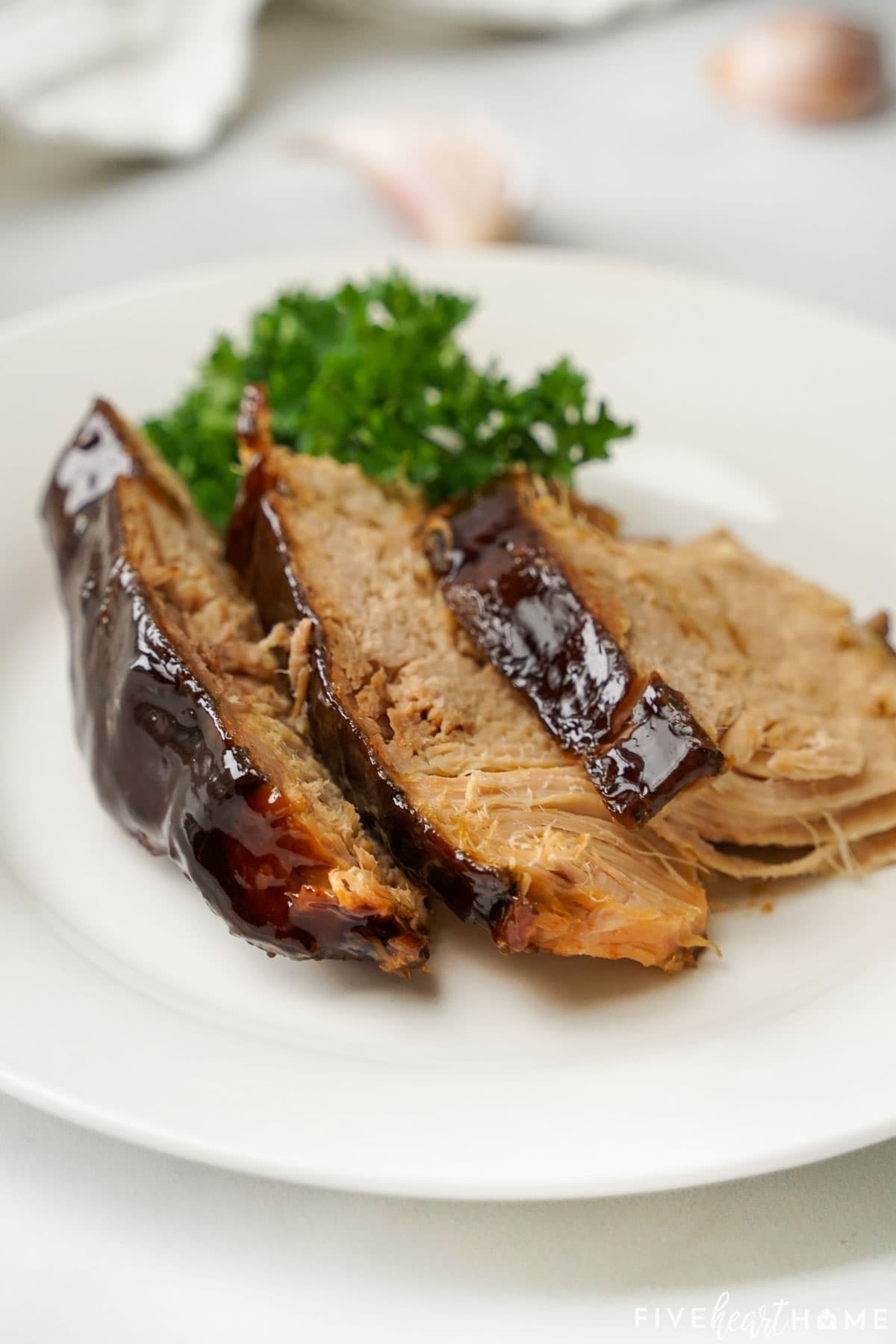 Slices of Crock Pot Pork Loin on plate.