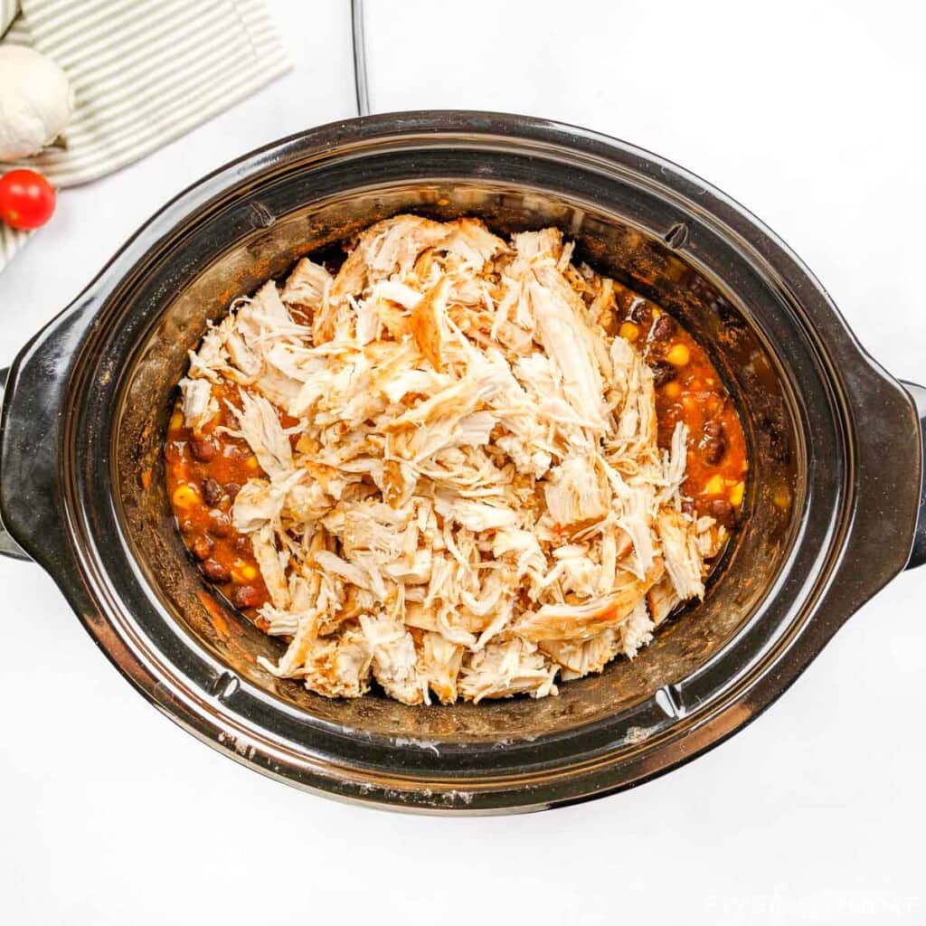 Crockpot Shredded Chicken Tacos mixture ready in slow cooker.