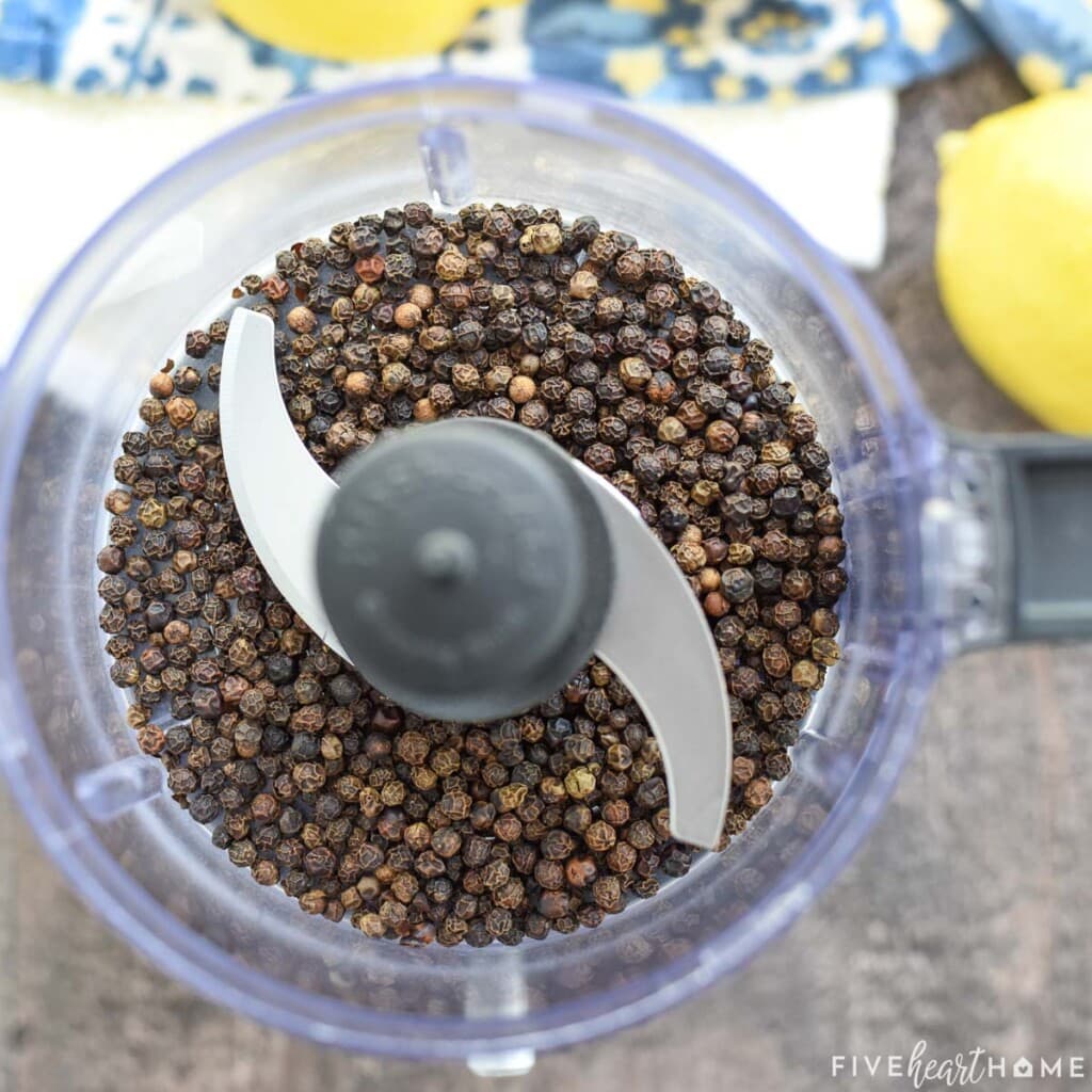 Black peppercorns in food processor.