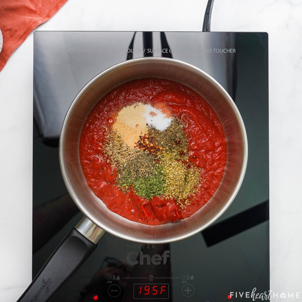 Aerial view of ingredients to make pizza sauce for dipping.