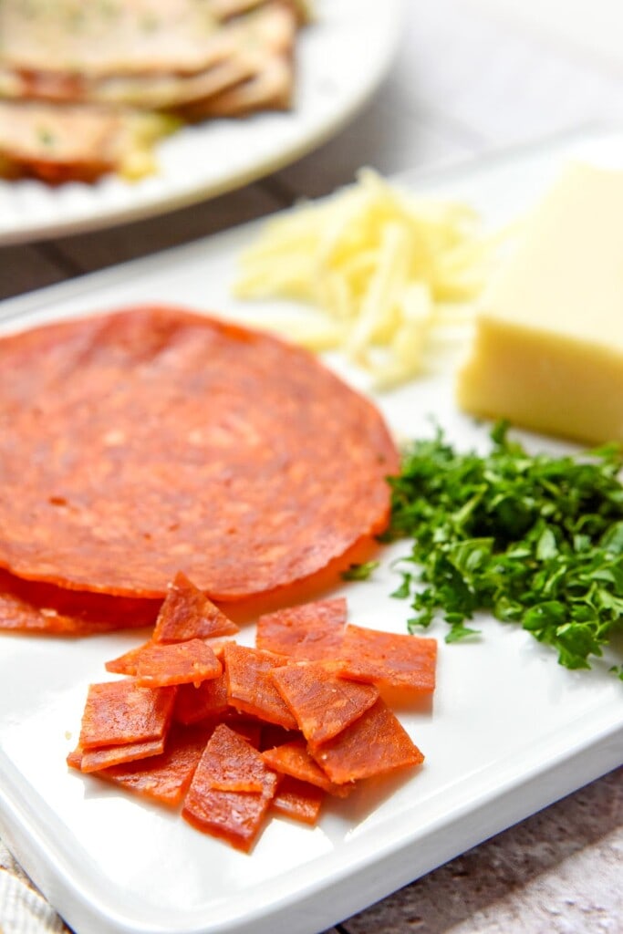 Ingredients to make Pizza Quesadillas on cutting board.