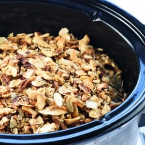 Crock Pot Granola showing close-up of slow cooker granola in crockpot.