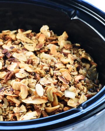 Crock Pot Granola showing close-up of slow cooker granola in crockpot.