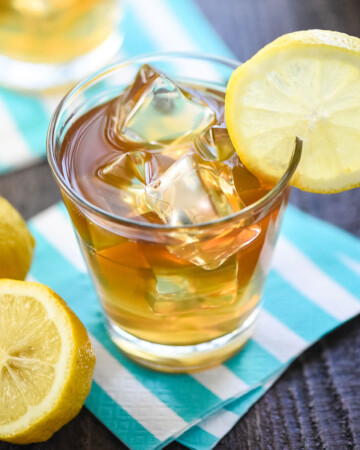 John Daly Drink (or Arnold Palmer Drink with alcohol) in glass with ice and lemons.
