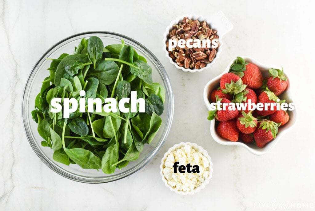 Labeled ingredients to make Spinach Salad with Strawberries.