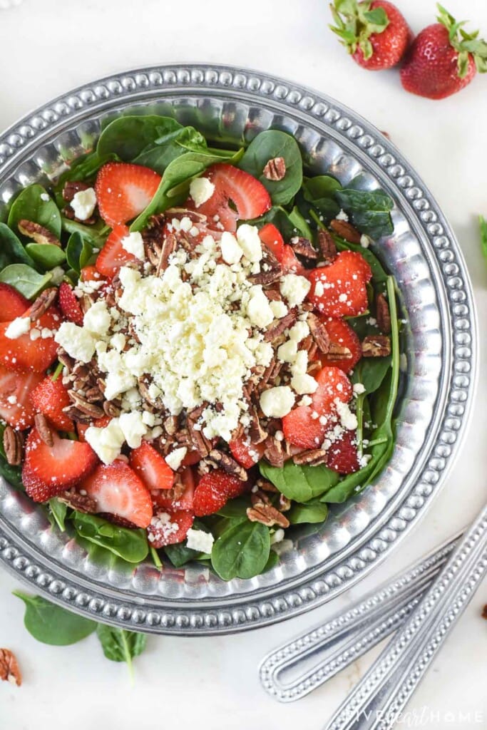 Aerial view of Spinach Salad with Strawberries in serving bowl.
