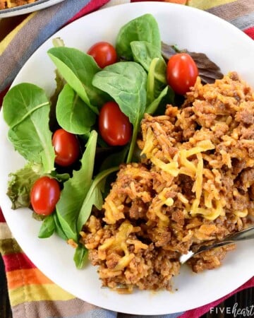 Taco Hamburger Helper on plate with side salad.