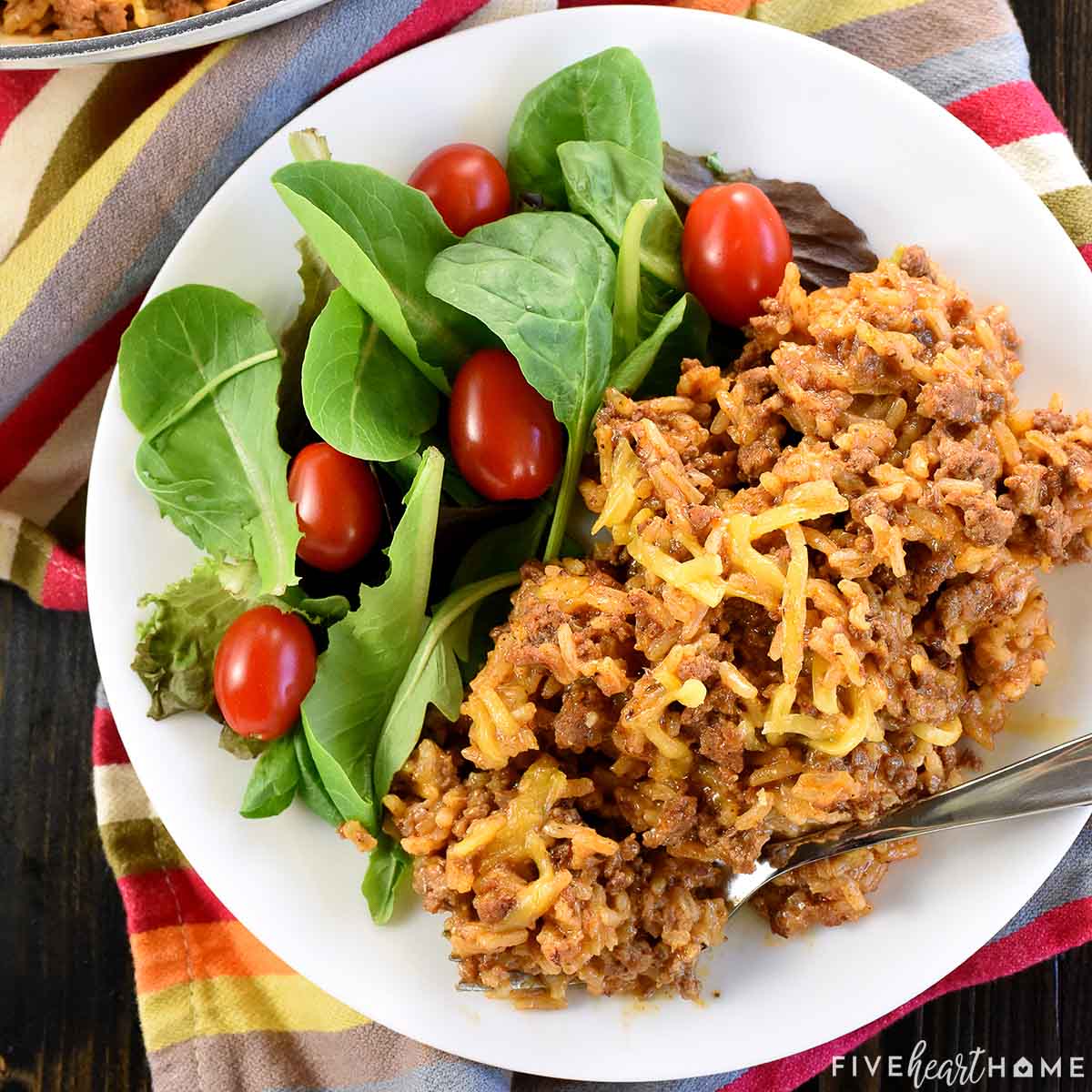 Taco Hamburger Helper on plate with side salad.