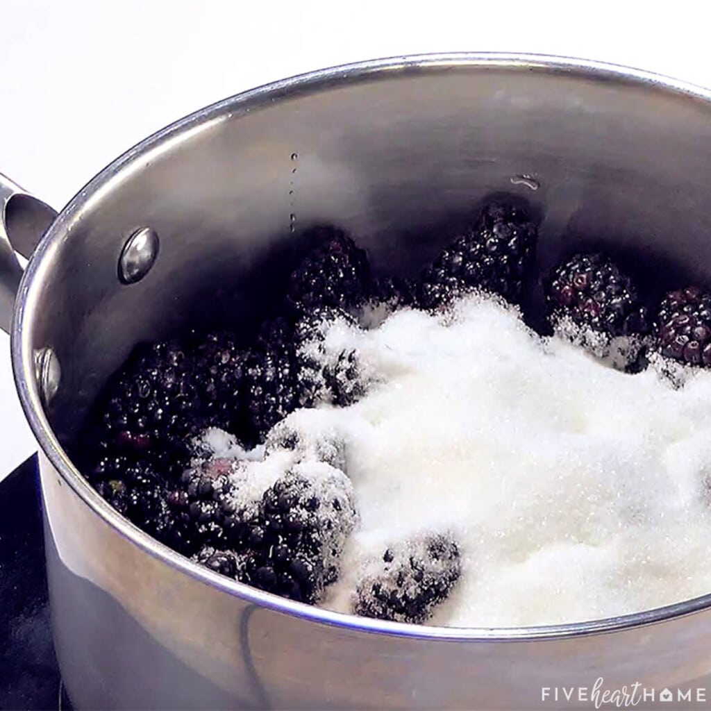 Adding sugar to pot.