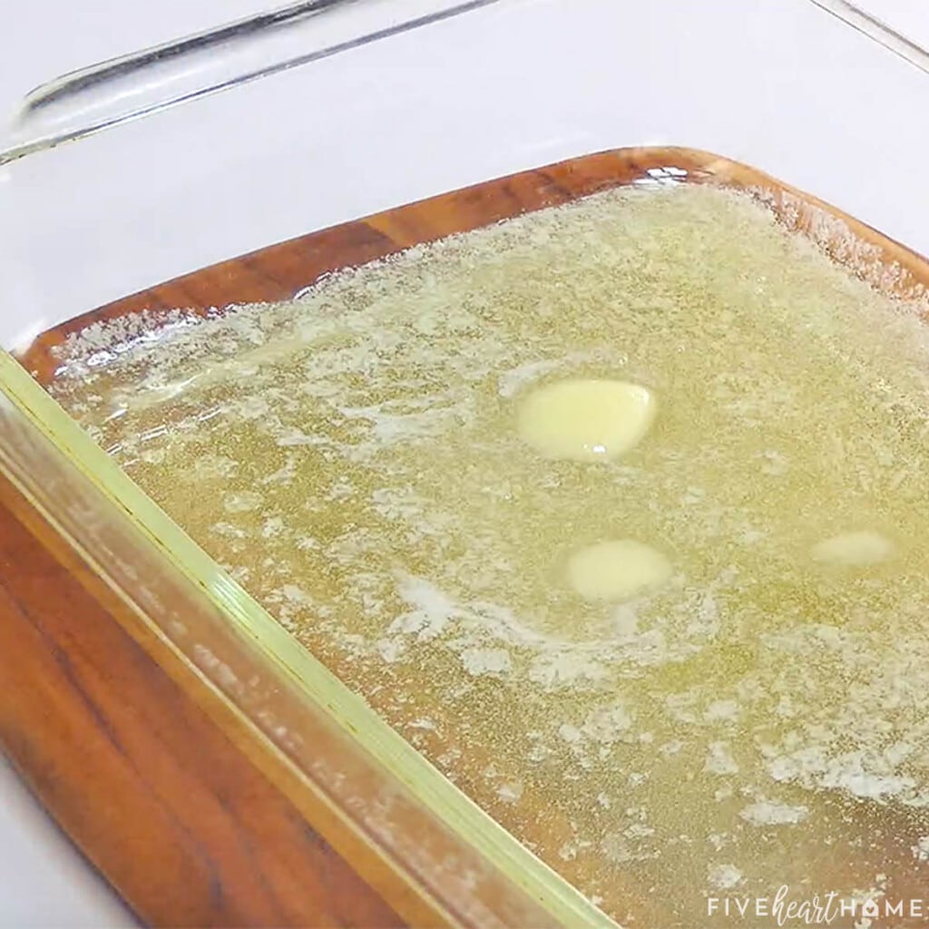 Melted butter in baking dish.