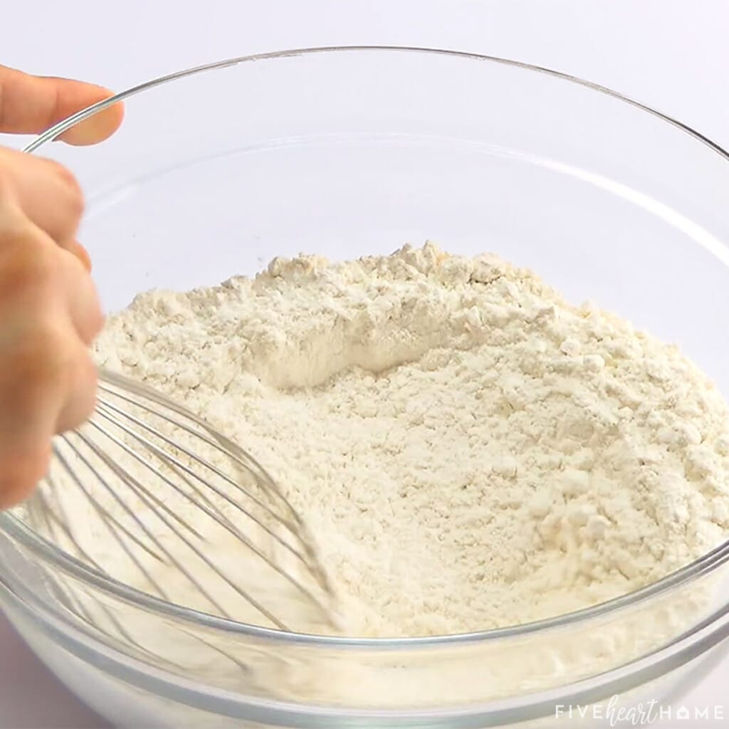 Whisking dry ingredients in bowl.