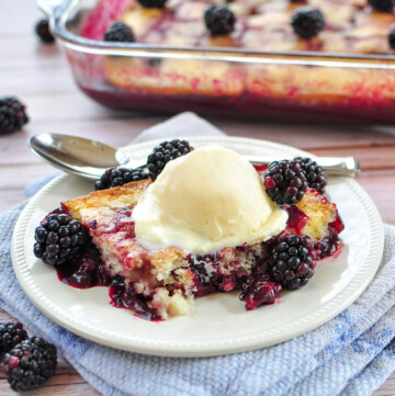 Blackberry Cobbler in dish and on plate with scoop of ice cream.