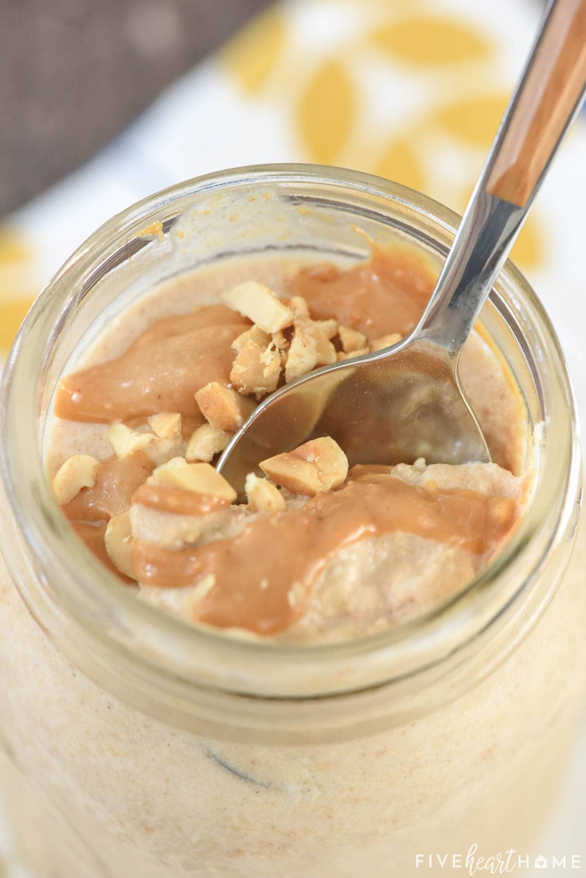 Peanut Butter Overnight Oats close-up with spoon digging in.