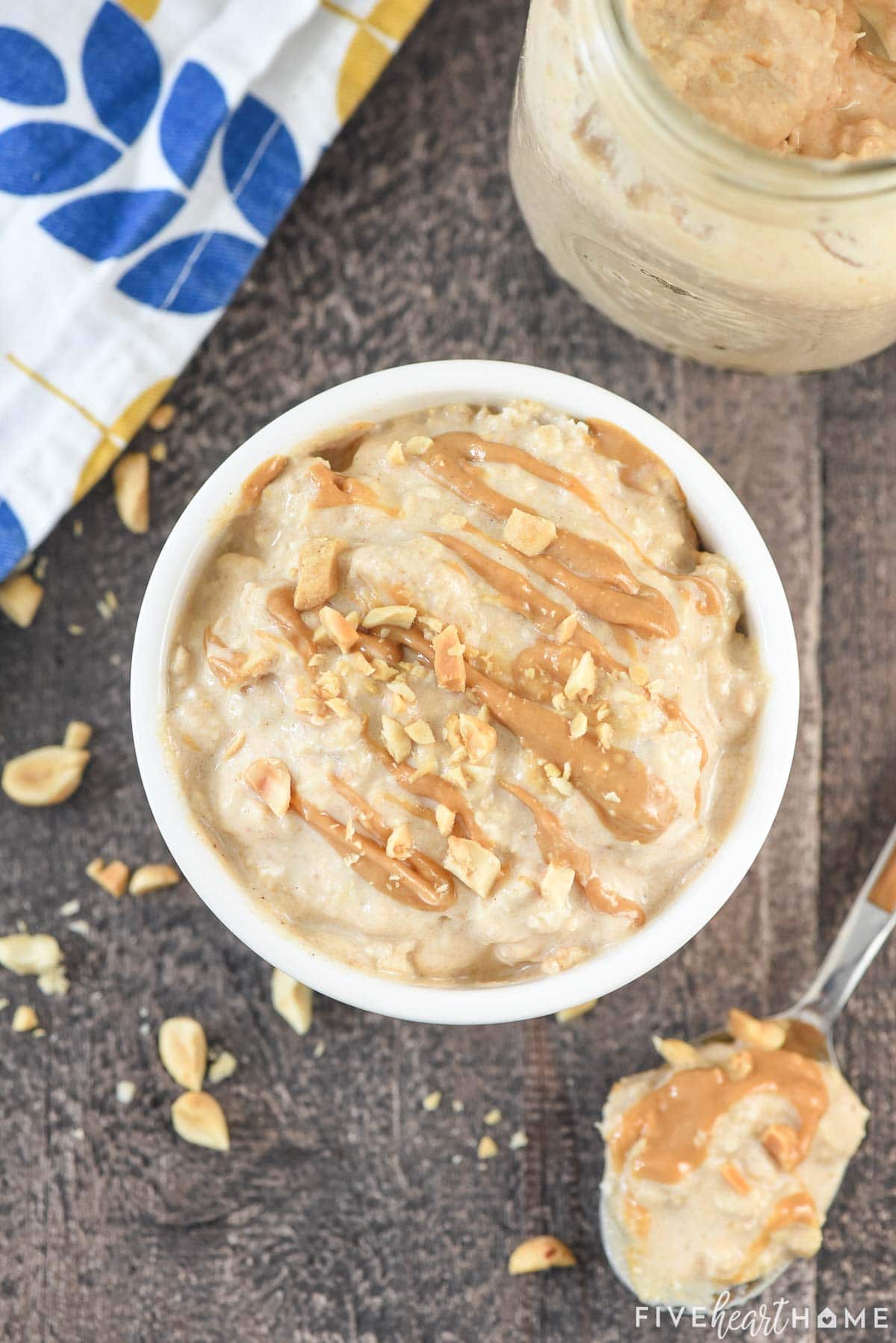 Peanut Butter Overnight Oats recipe in bowl with peanuts and peanut butter on top.