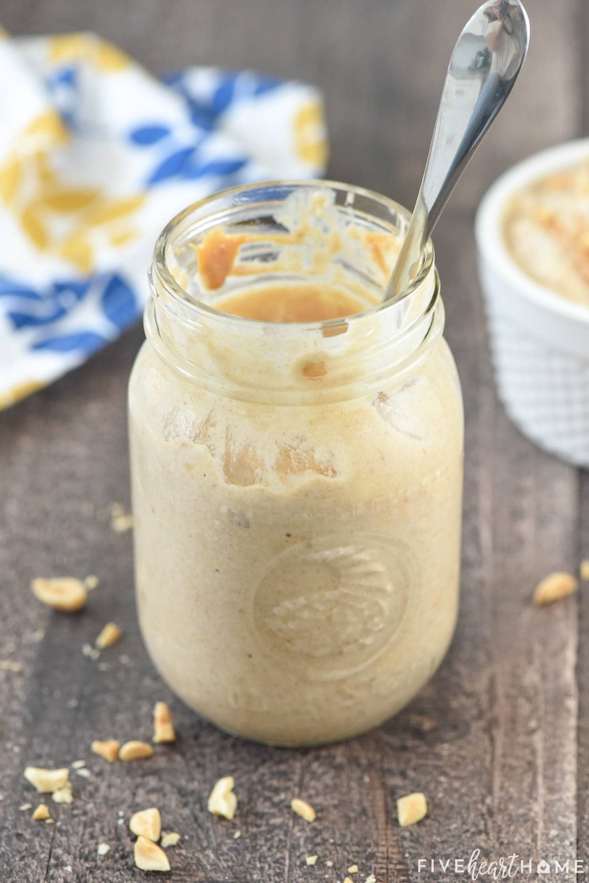 Peanut Butter Overnight Oats with spoon in jar.