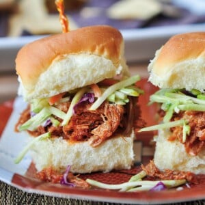 Root Beer Pulled Pork recipe served on buns with slaw.