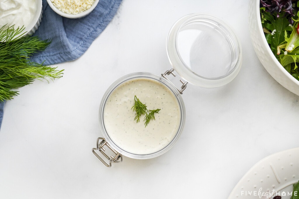 Creamy Feta Dressing in jar with lid.