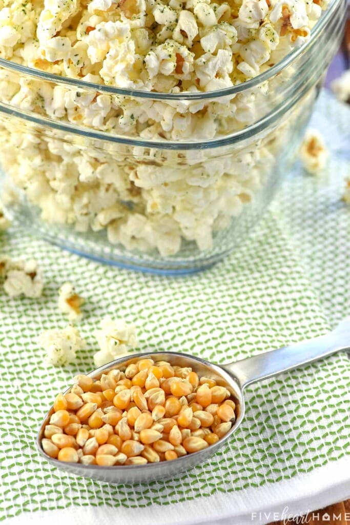 Cup of popcorn kernels ready to pop.