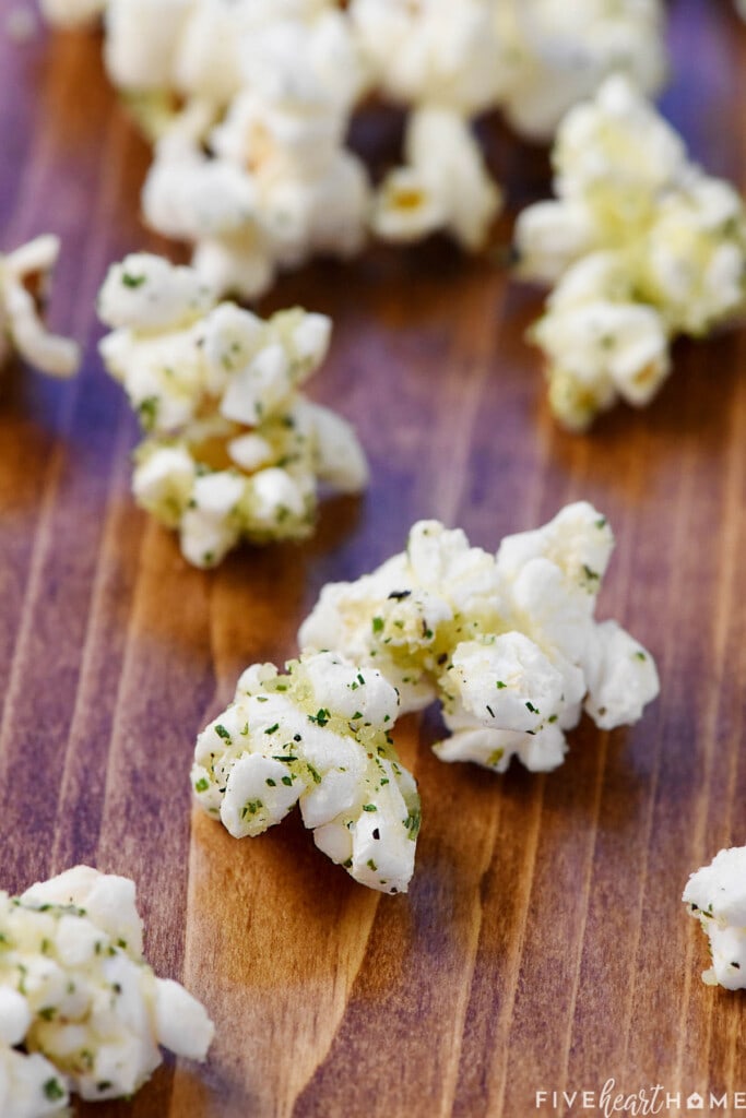 Piece of Parmesan popcorn coated with Ranch Popcorn Seasoning.