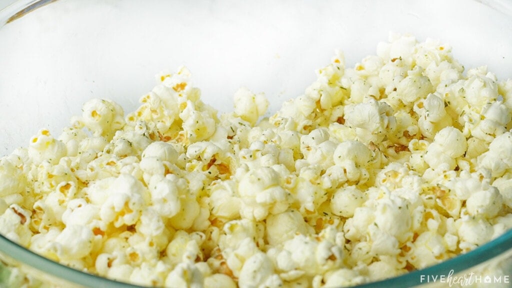 Ranch Popcorn Seasoning mixed into popcorn.