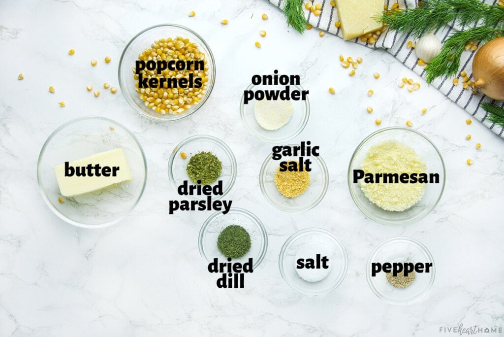 Labeled ingredients to make Ranch Popcorn Seasoning over buttery Parmesan popcorn.
