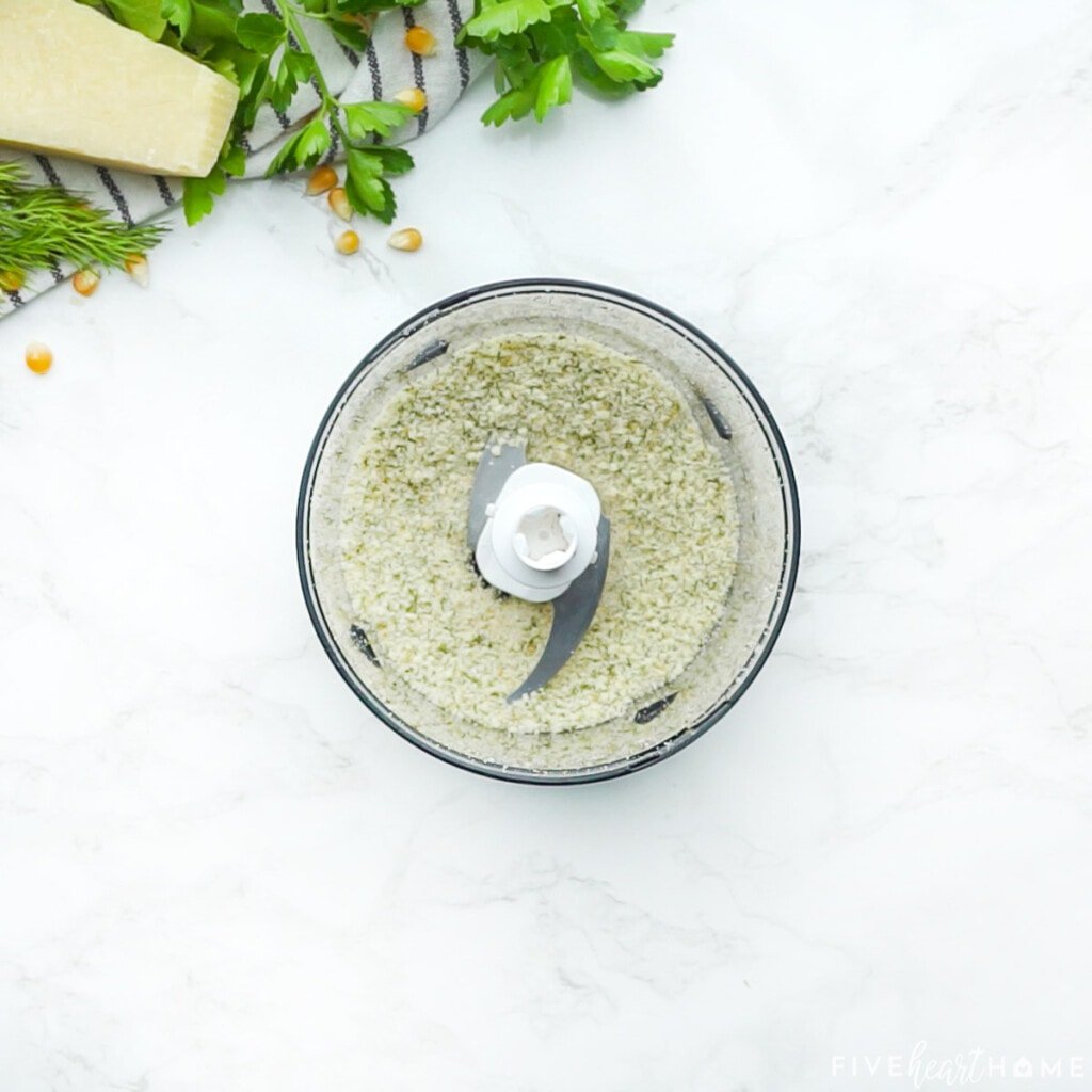 Grinding Ranch Popcorn Seasoning into a fine powder in food processor.