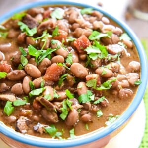 Charro Beans in bowl with cilantro.