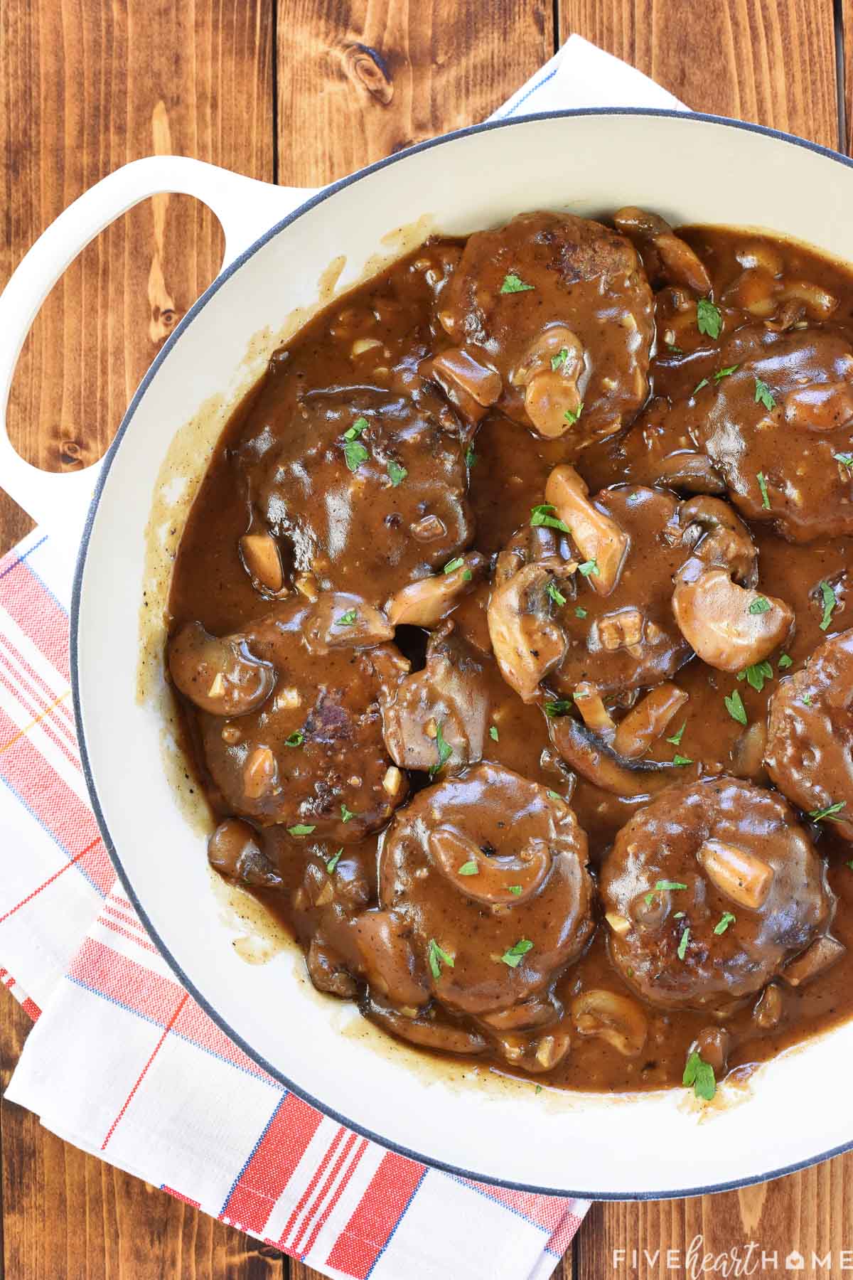 Hamburger Steak and gravy in skillet.