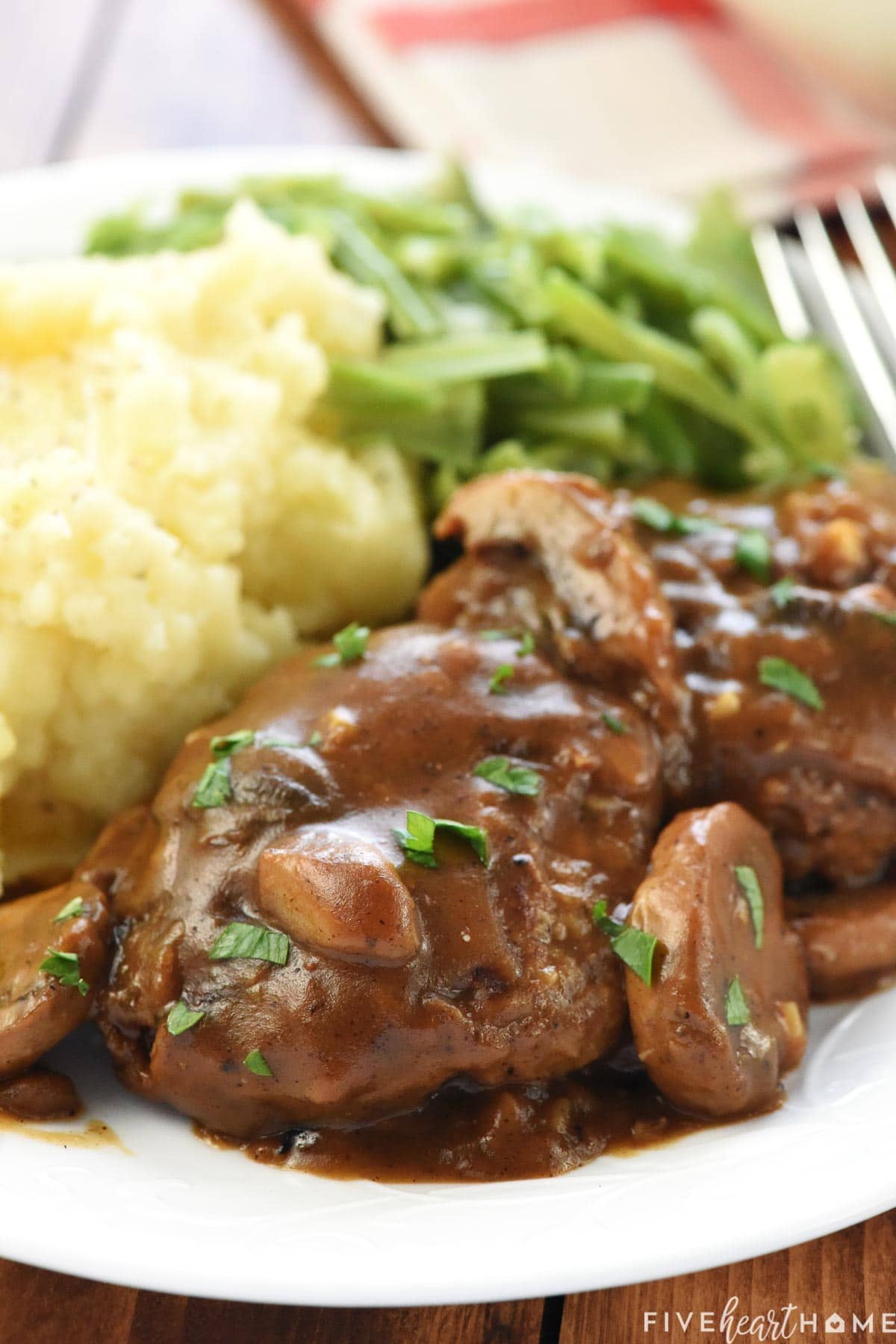 Hamburger Steak on plate with sides.