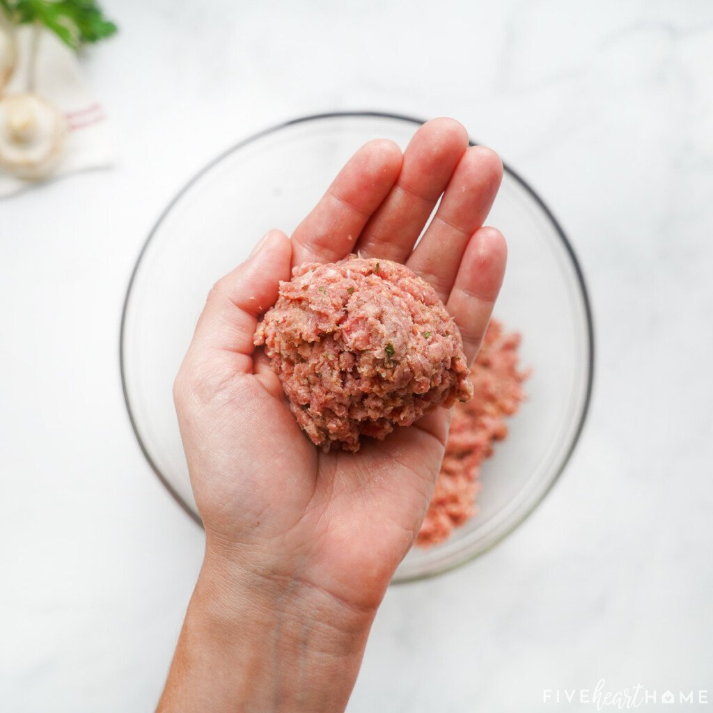 Forming a ball of ground beef mixture to make hamburger steak.