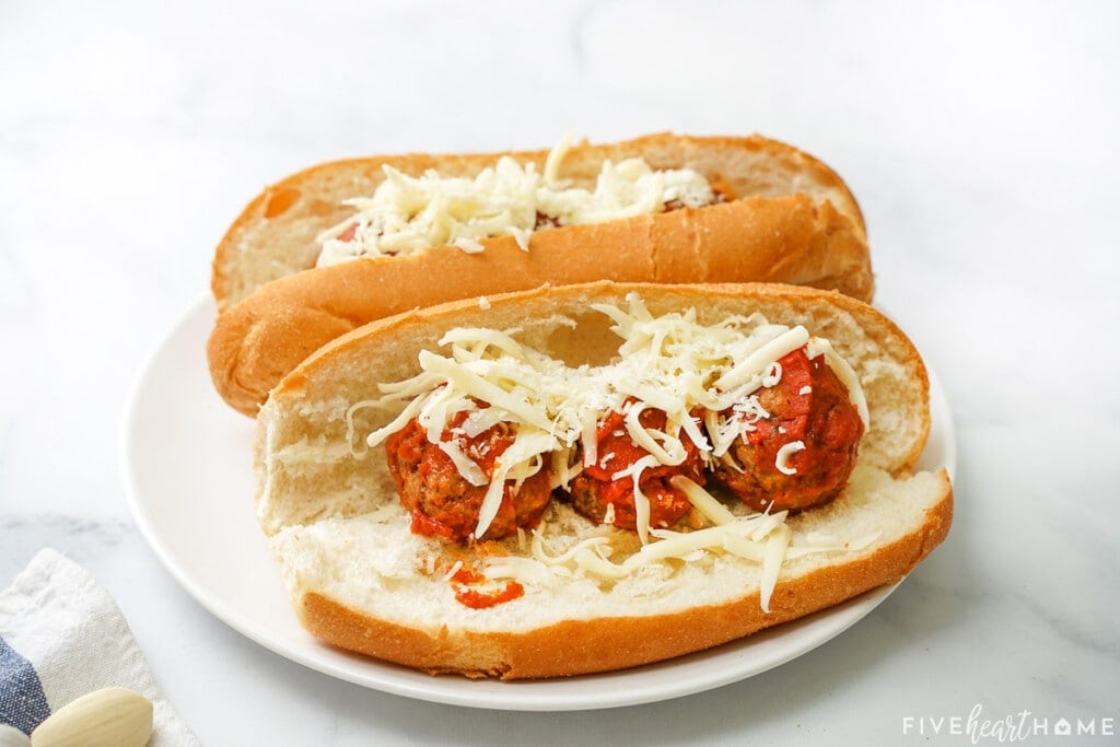 Meatball subs with cheese ready to melt.