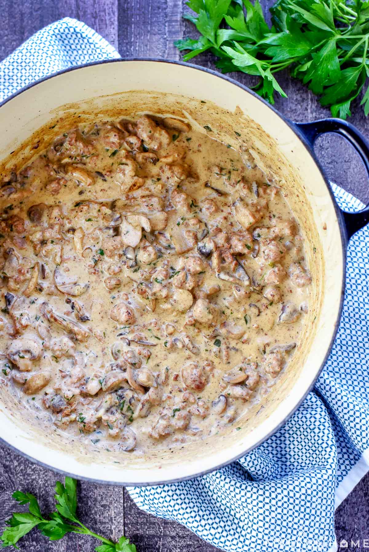 Aerial view of pot containing beef stroganoff with ground beef.