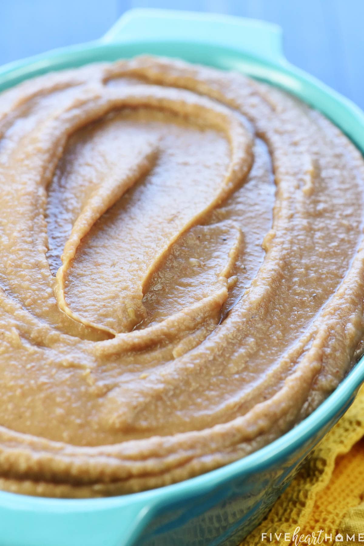 Refried beans recipe in blue bowl.